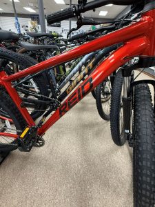 Close-up of red Reid Giant mountain bike frame on showroom floor